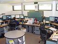 Emergency medical dispatcher at work in a 911 dispatch center.