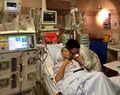Patient in intensive care with hemodialysis machine