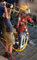 U.S. Navy Sailors assigned to Mobile Diving and Salvage Unit Two (MDSU-2), Detachment Two, work together to thoroughly clean and sanitize a diver immediately after completing dive operations