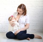 Barefoot Dutch Woman Breastfeeding