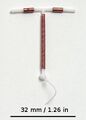 Copper IUD with scale for size reference