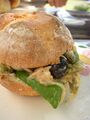 Pan bagnat with ingredients displayed