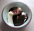 Chocolate sauce and vanilla ice cream