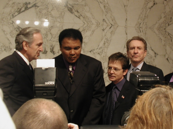 Actor Michael J. Fox and boxer Muhammad Ali are pictured in 2002 speaking before the US Senate to urge increased funding for Parkinson's research