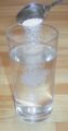 Salt dissolving in water to form a solution