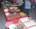A variety of dishes at a potluck gathering.