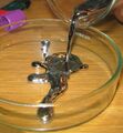 Pouring liquid mercury