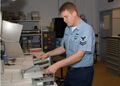 Electronics Technician testing an Alpha Particle Detection Probe