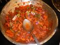 Afritada served in a buffet setting