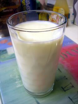 Glass of milk on tablecloth