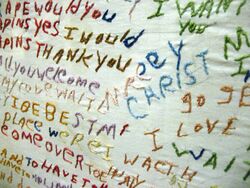 An embroidered cloth created by a person with schizophrenia