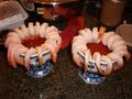 Two servings of cocktail shrimp with dipping sauce