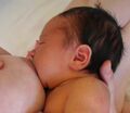 Asymmetric breastfeeding latch