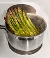 Steam boiling green asparagus