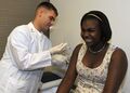 Hospital Corpsman giving a tetanus shot